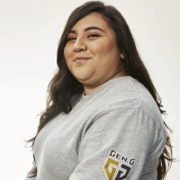 Person wearing Gen.G esports shirt, smiling.