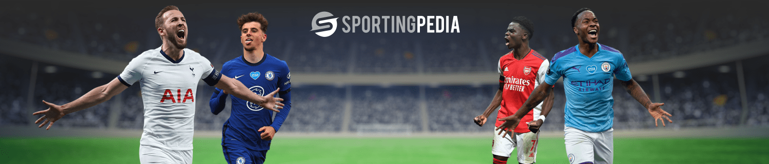 Football players celebrating with SportingPedia logo in stadium.