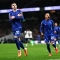 Cole Palmer celebrates after scoring a penalty against Tottenham