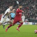 Mohamed Salah sprinting with the ball at his feet