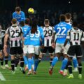 Napoli's Scott McTominay heads the ball after a corner kick