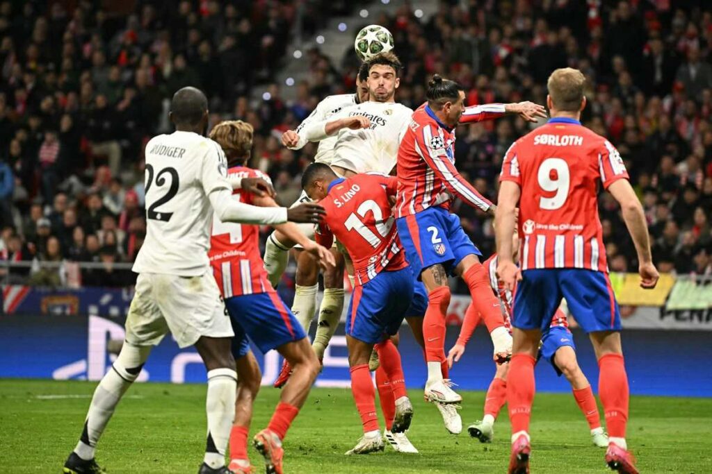 Raul Asencio outjumping Atletico Madrid defence