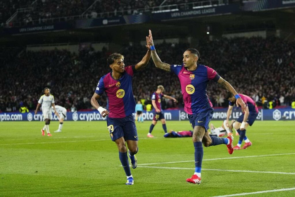 Raphina and Lamine Yamal celebrate Barcelona's goal against Benfica