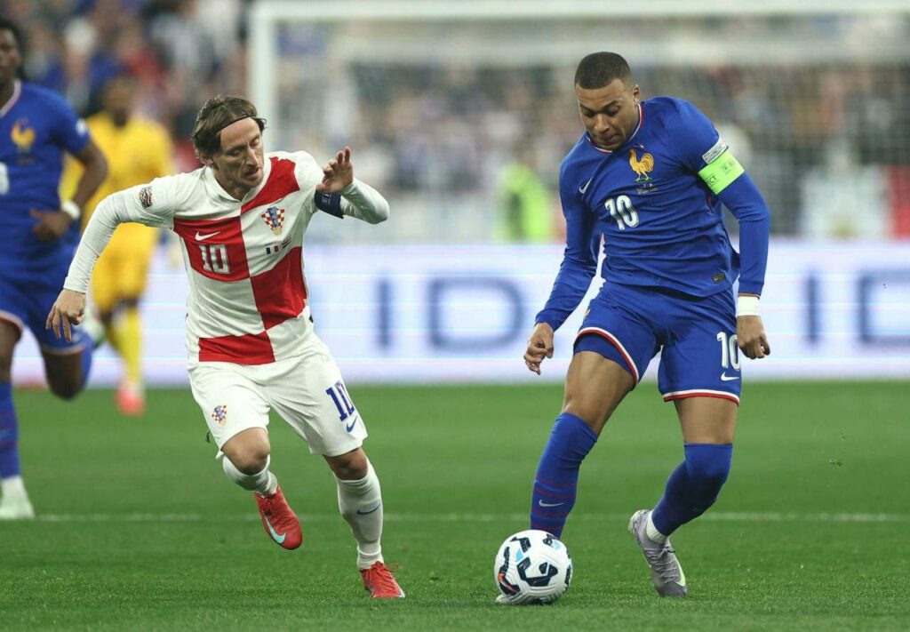 Real Madrid teammates Luka Modric and Kylian Mbappe against one another during the France - Croatia Nations League match