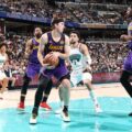 Austin Reaves with the ball in Lakers' game against the Memphis Grizzlies
