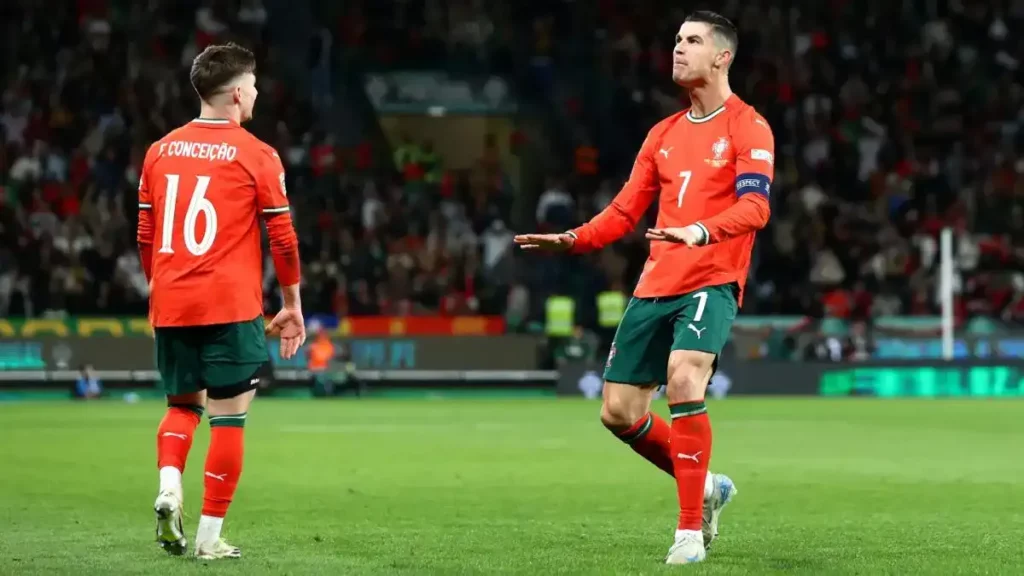 Cristiano Ronaldo calming the home crowd after scoring against Denmark