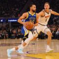 Steph Curry attacking Denver Nuggets' basket