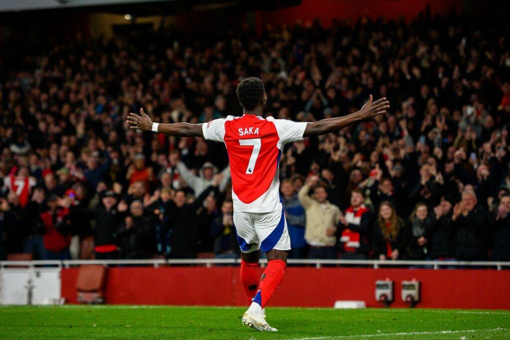 Bukayo Saka celebrates after scoring on his return from injury