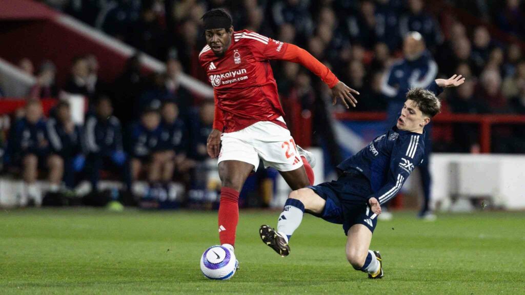 Manchester United's Alejandro Garnacho trying to stop Nottingham's Anthony Elanga
