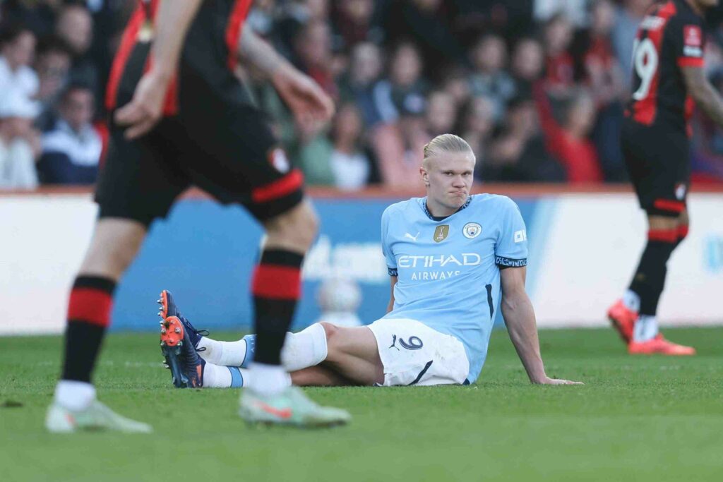 Erling Haaland sitting on the ground after getting injured during FA Cup semi-final against Bournemouth