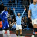 Jack Grealish celebrates after scoring against Leicester