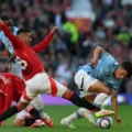 Casemiro battles for the ball with Rico Lewiss during the Manchester derby between United and City