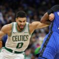 Jayson Tatum guarded by Kentavius Caldwell-Pope