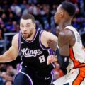 Zach LaVine guarded by Dennis Schroder