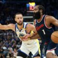 Steph Curry attempting to stop James Harden from attacking the basket