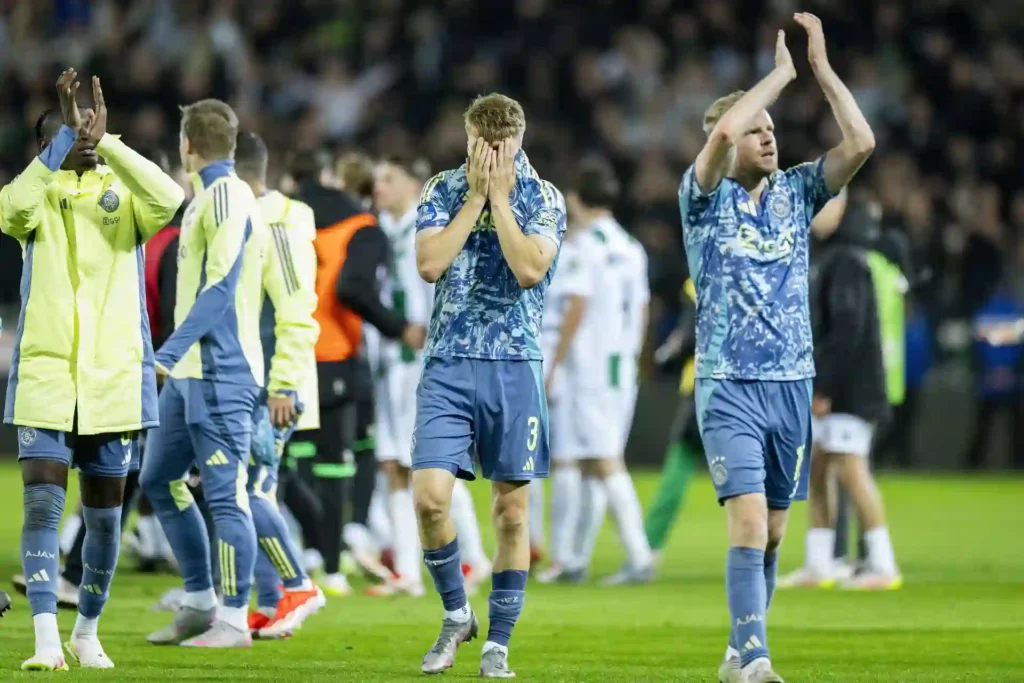 Ajax players leaving the field in disbelief after conceding 99th minute equalizer to Groningen