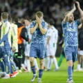 Ajax players leaving the field in disbelief after conceding 99th minute equalizer to Groningen