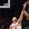 Jaylen Brown shoots over Josh Hart
