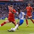 Brighton player tries to pass the ball inside Liverpool's penalty box