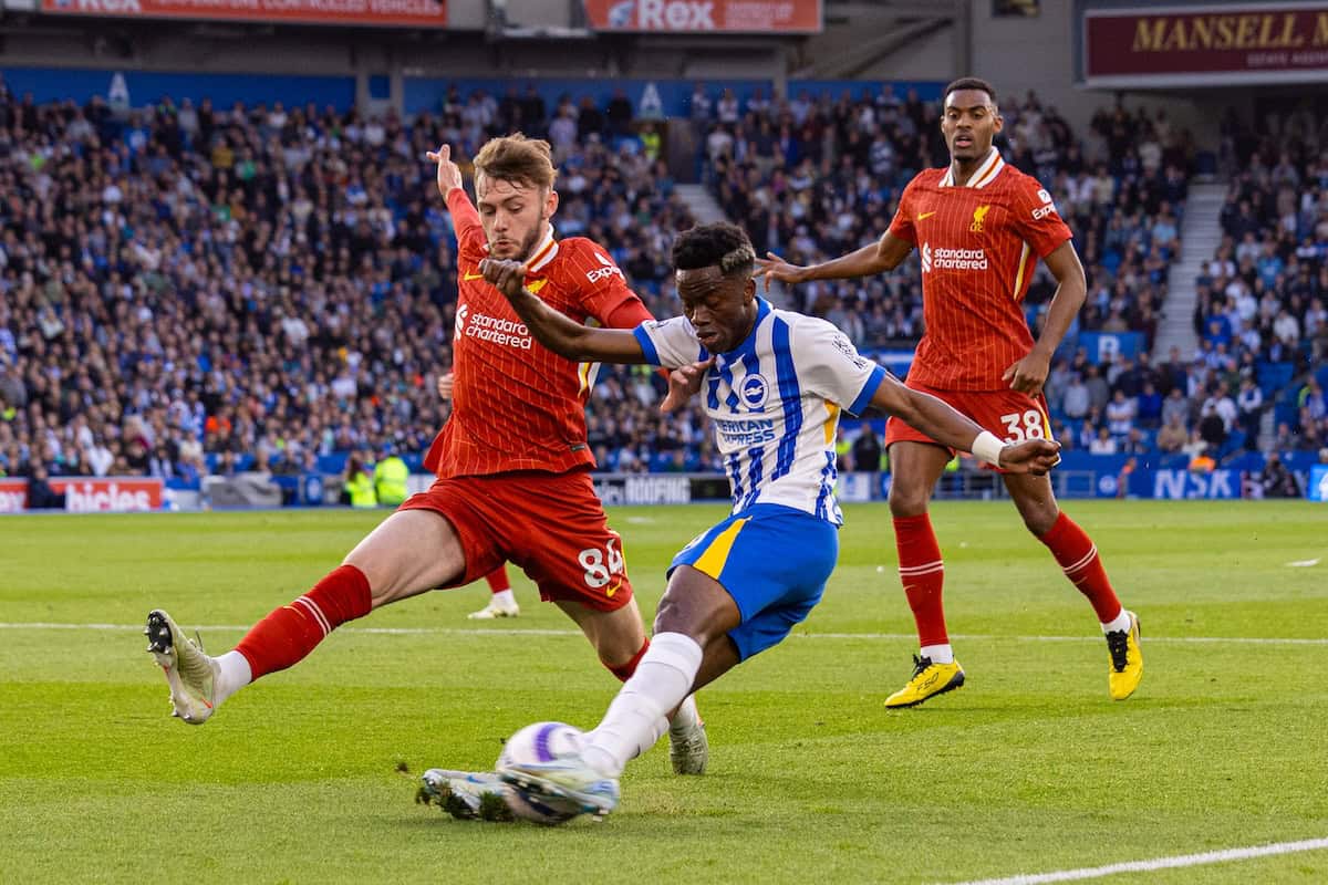 Brighton player tries to pass the ball inside Liverpool's penalty box