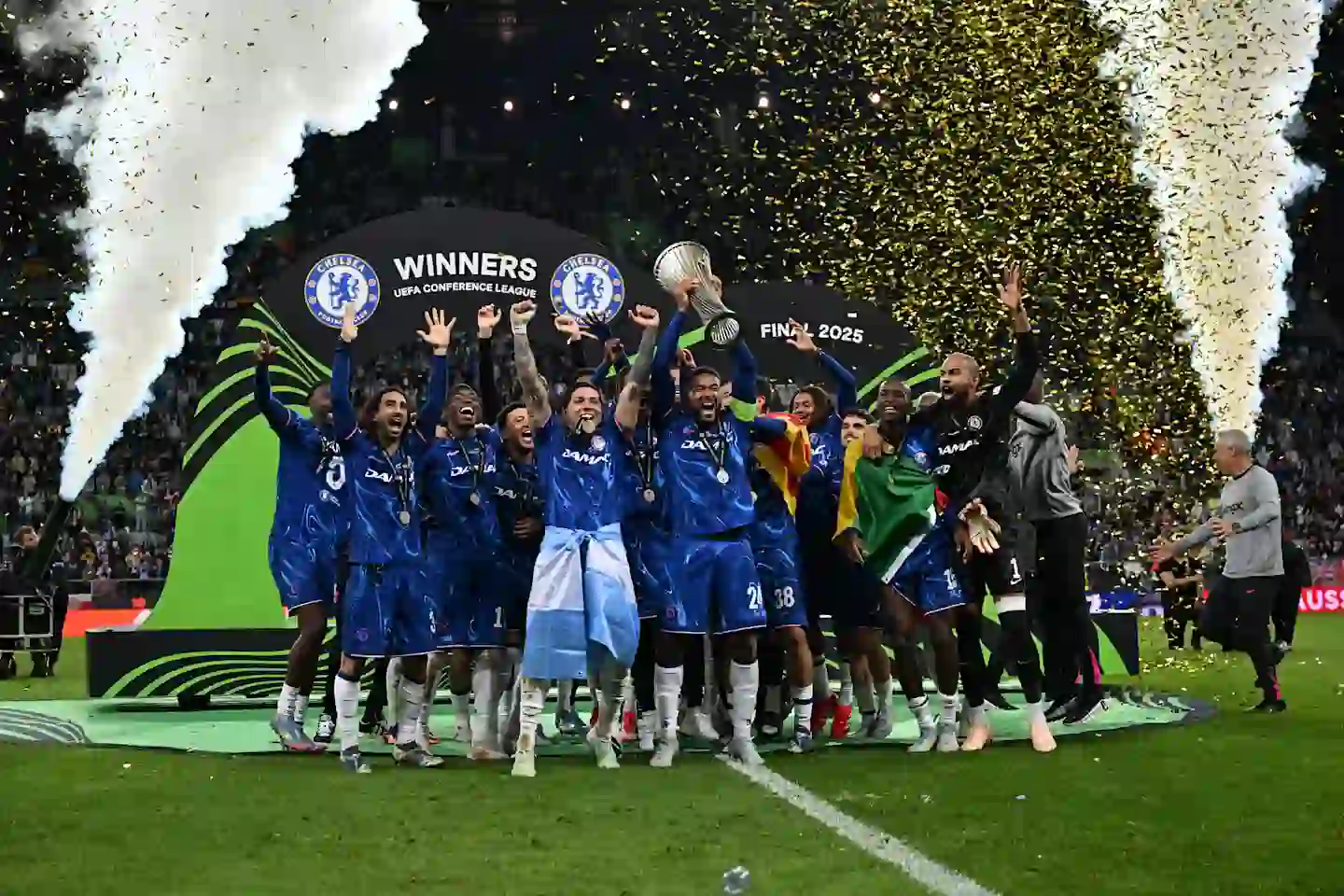 Chelsea celebrating with the Europa Conference League trophy