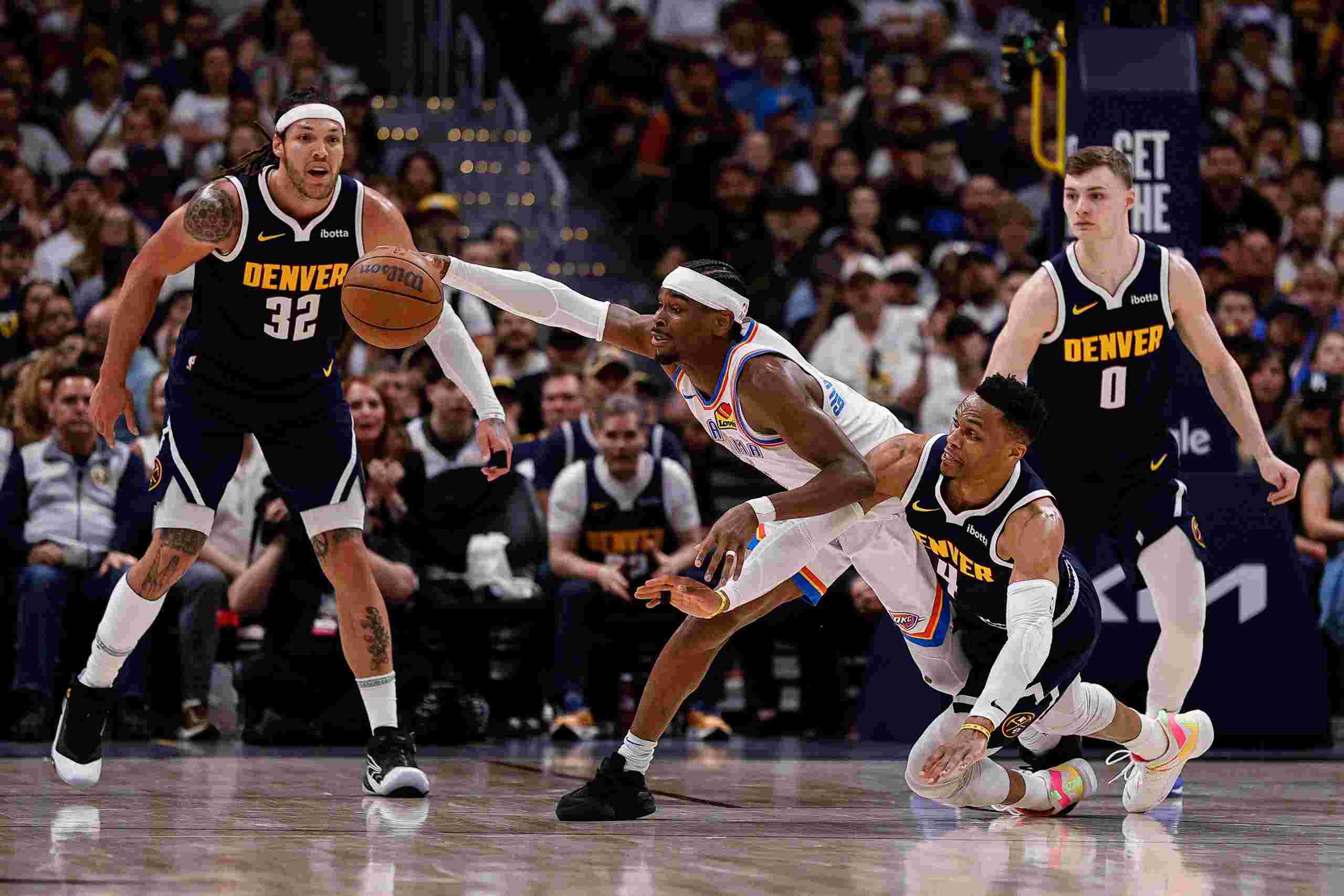 Russell Westbrook trying to steal the ball off Shai Gilgeous-Alexander