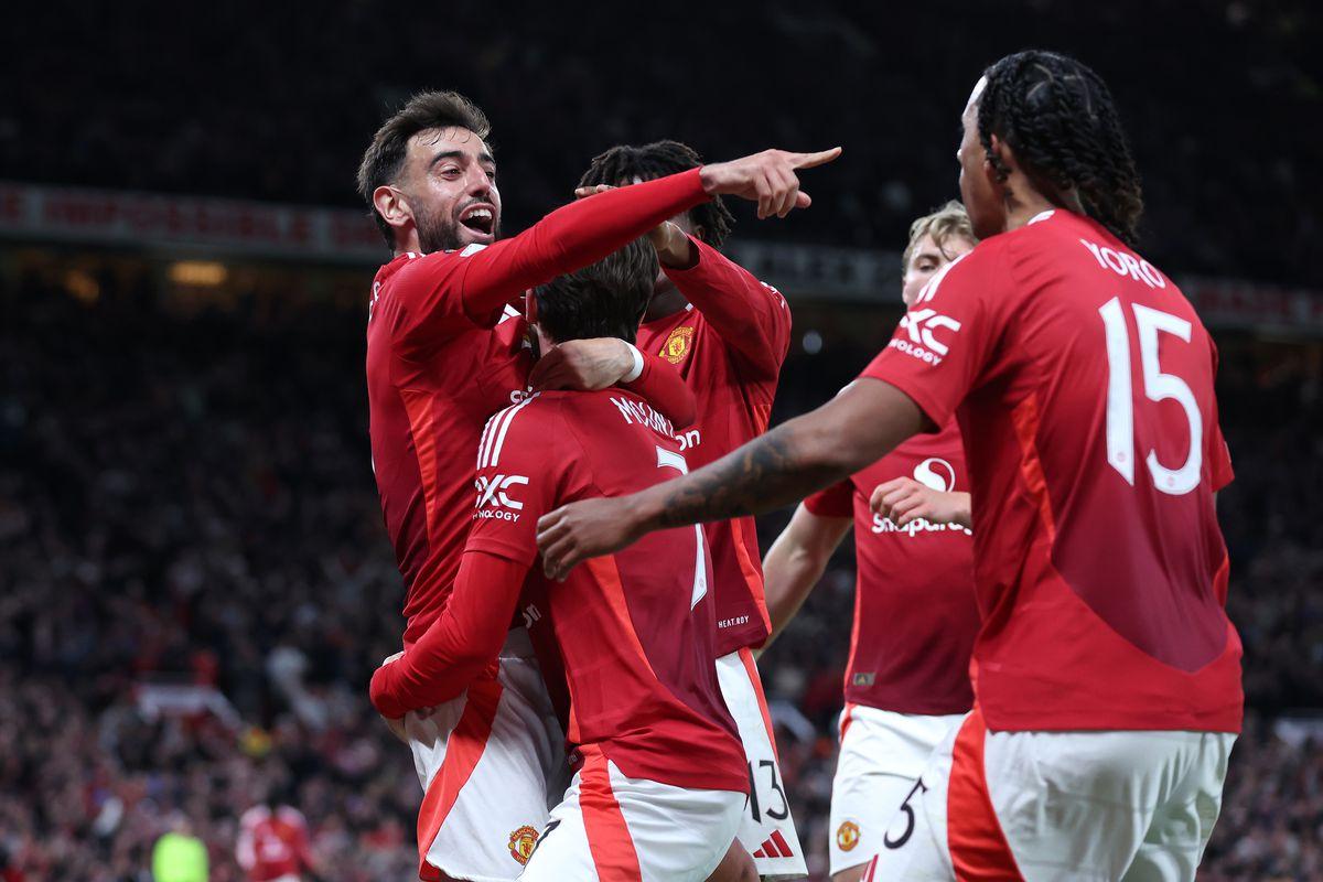 Manchester United players celebrate after scoring against Athletic Bilbao