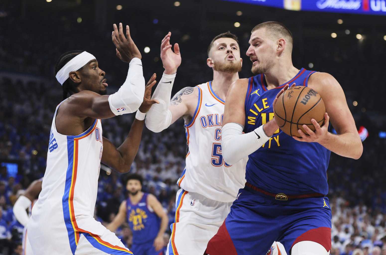 Nikola Jokic double-teamed by Shai Gilgeous-Alexander and Isaiah Hartenstein