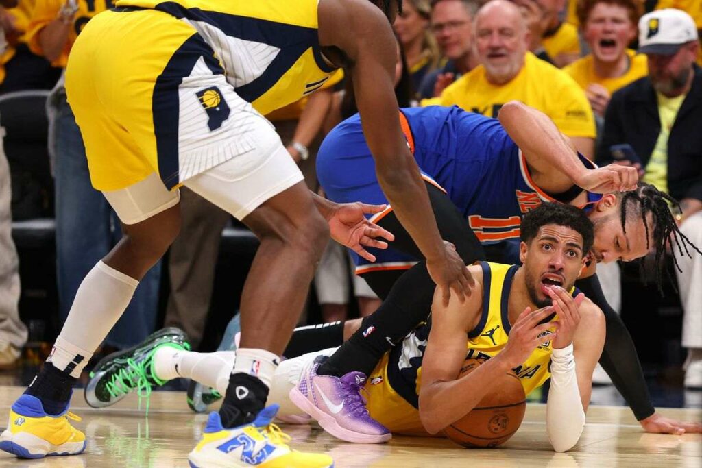 Tyrese Haliburton calls for a time-out while on the floor