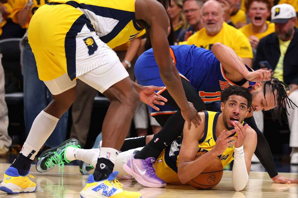 Tyrese Haliburton calls for a time-out while on the floor