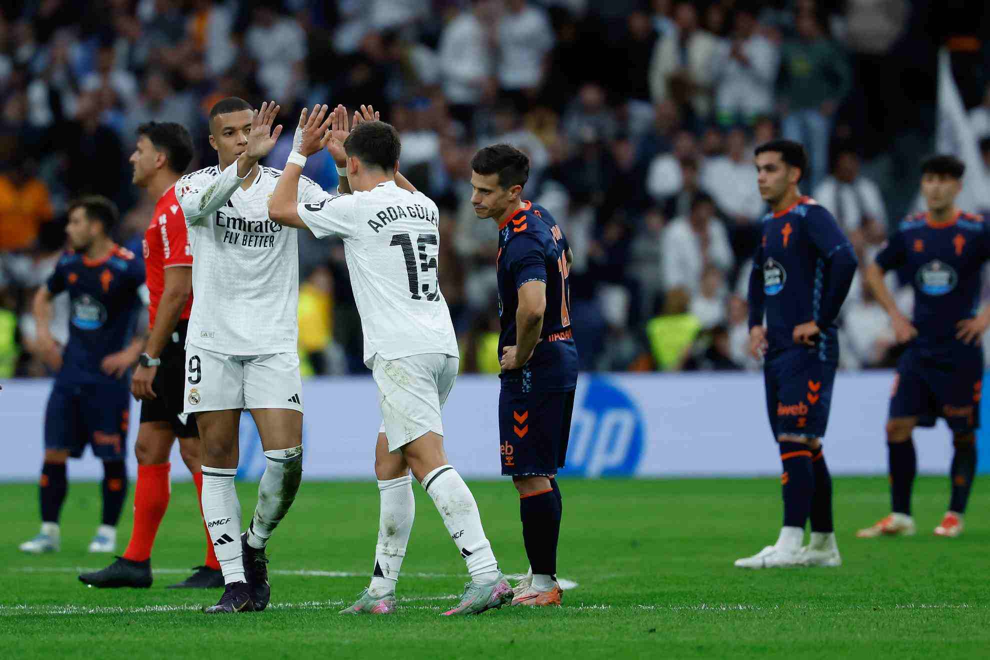 Kylian Mbappe and Arda Guler celebrate after combining for one of Real Madrid goals against Celta