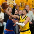 Josh Hart trying to block Tyrese Haliburton from scoring a lay-up