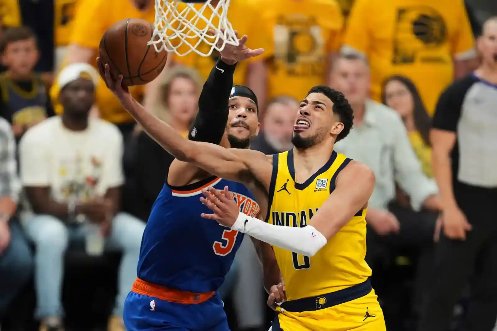 Josh Hart trying to block Tyrese Haliburton from scoring a lay-up