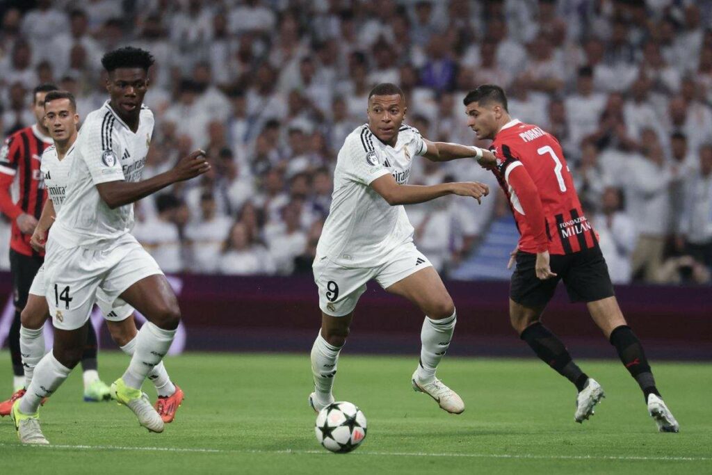 Kylian Mbappe and Aurelien Tchouameni chasing the ball in the Champions League game against Milan