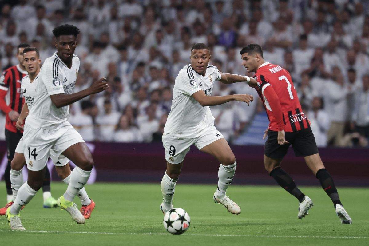 Kylian Mbappe and Aurelien Tchouameni chasing the ball in the Champions League game against Milan