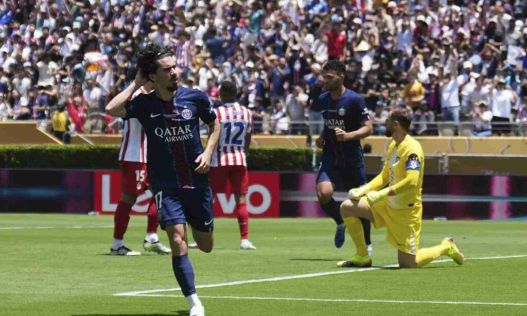 Vitinha celebrates after scoring in Atletico Madrid's net during the Club World Cup