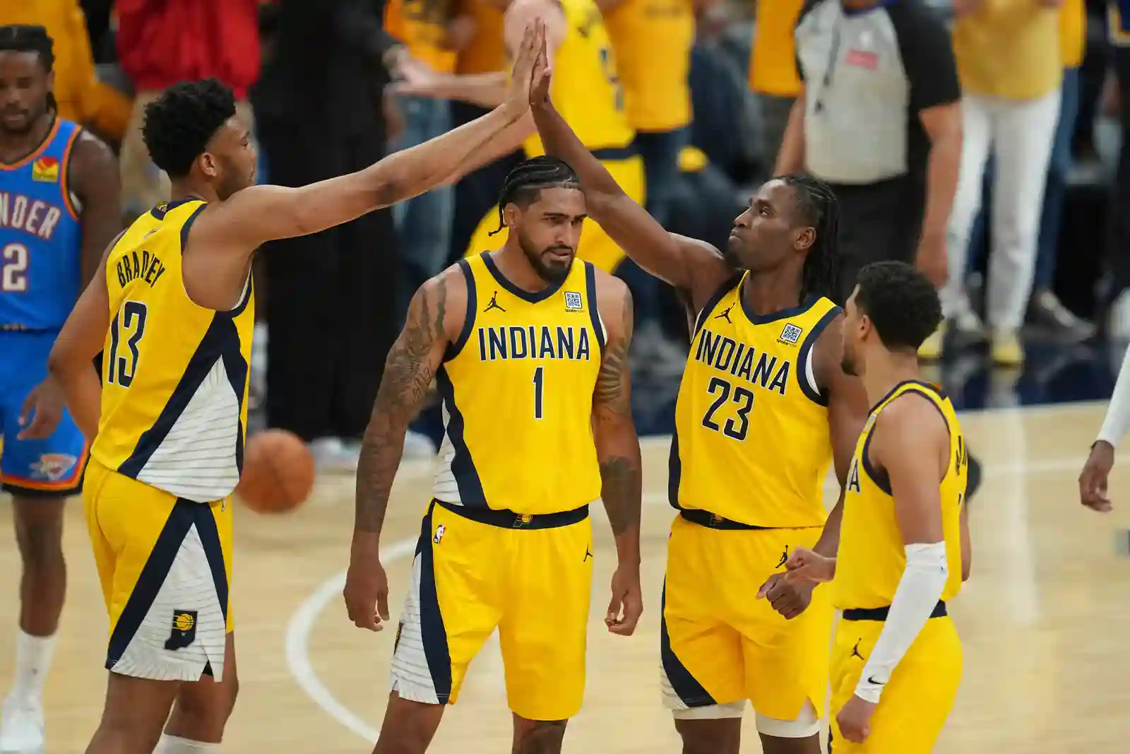 Indiana Pacers players congratulate each other during Game 6 of the NBA Finals against OKC Thunder