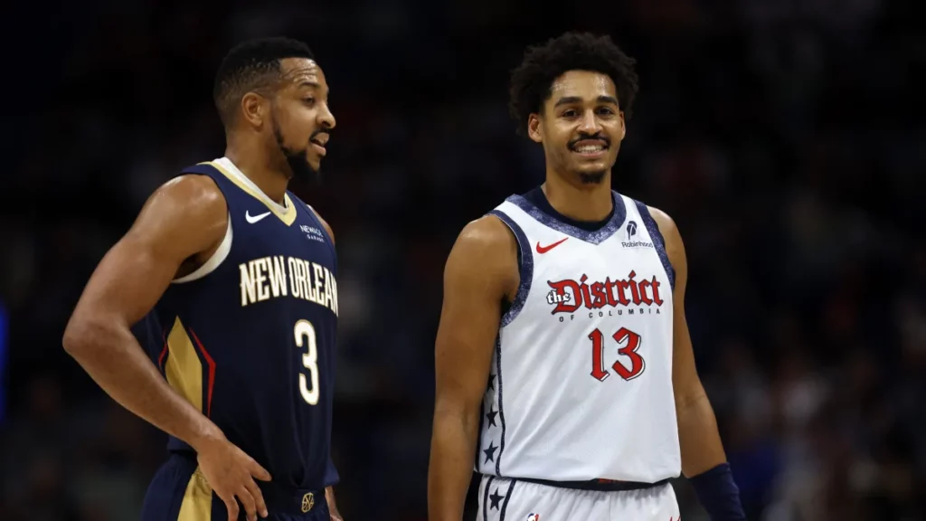 C.J. McCollum and Jordan Poole talk during NBA game between New Orleans Pelicans and Washington Wizards