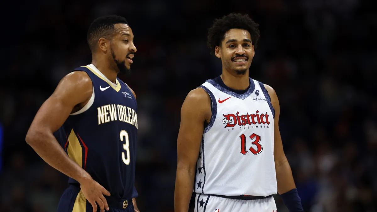 C.J. McCollum and Jordan Poole talk during NBA game between New Orleans Pelicans and Washington Wizards
