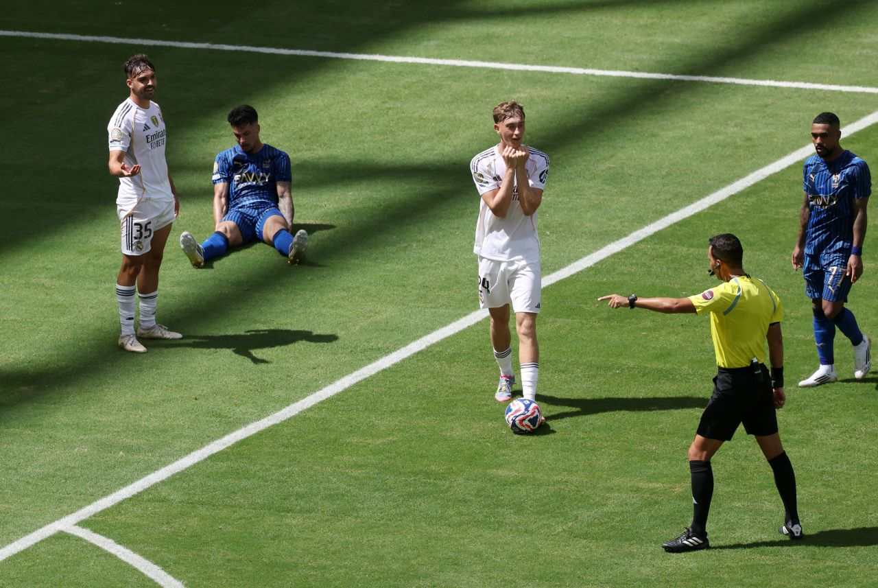 Referee points to the spot after Raul Asencio fouls Al-Hilal player in Real Madrid penalty box