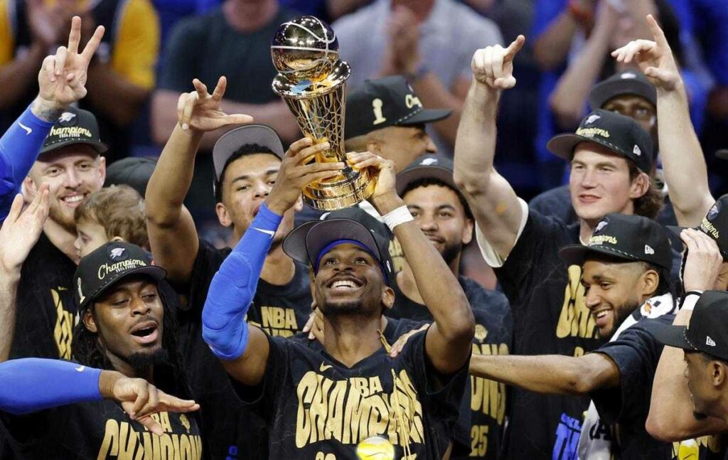 Shai Gilgeous-Alexander and the Oklahoma City Thunder with the NBA Championship trophy