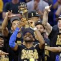 Shai Gilgeous-Alexander and the Oklahoma City Thunder with the NBA Championship trophy