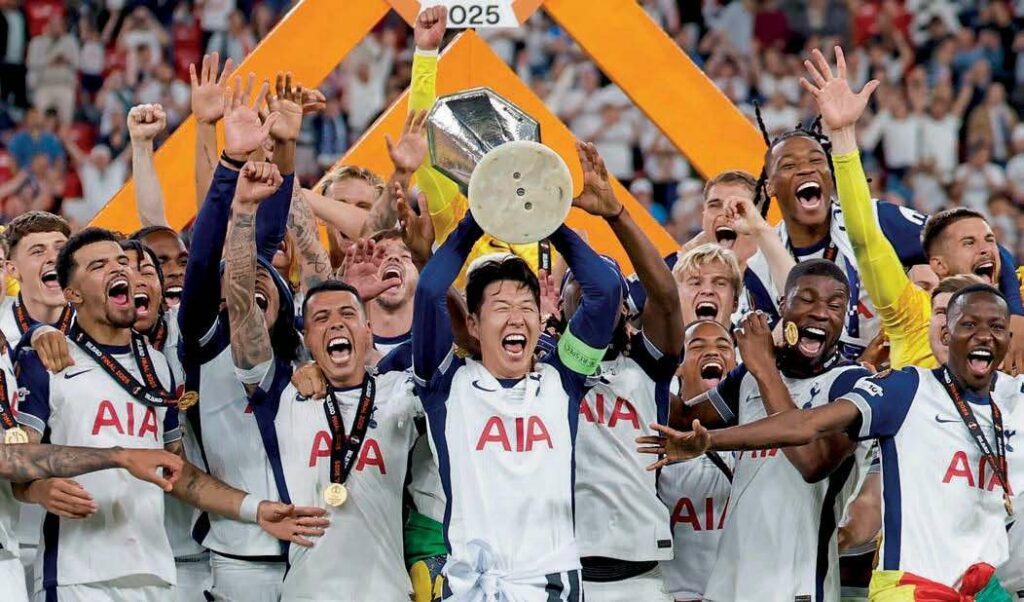 Tottenham players celebrate with the Europa League trophy
