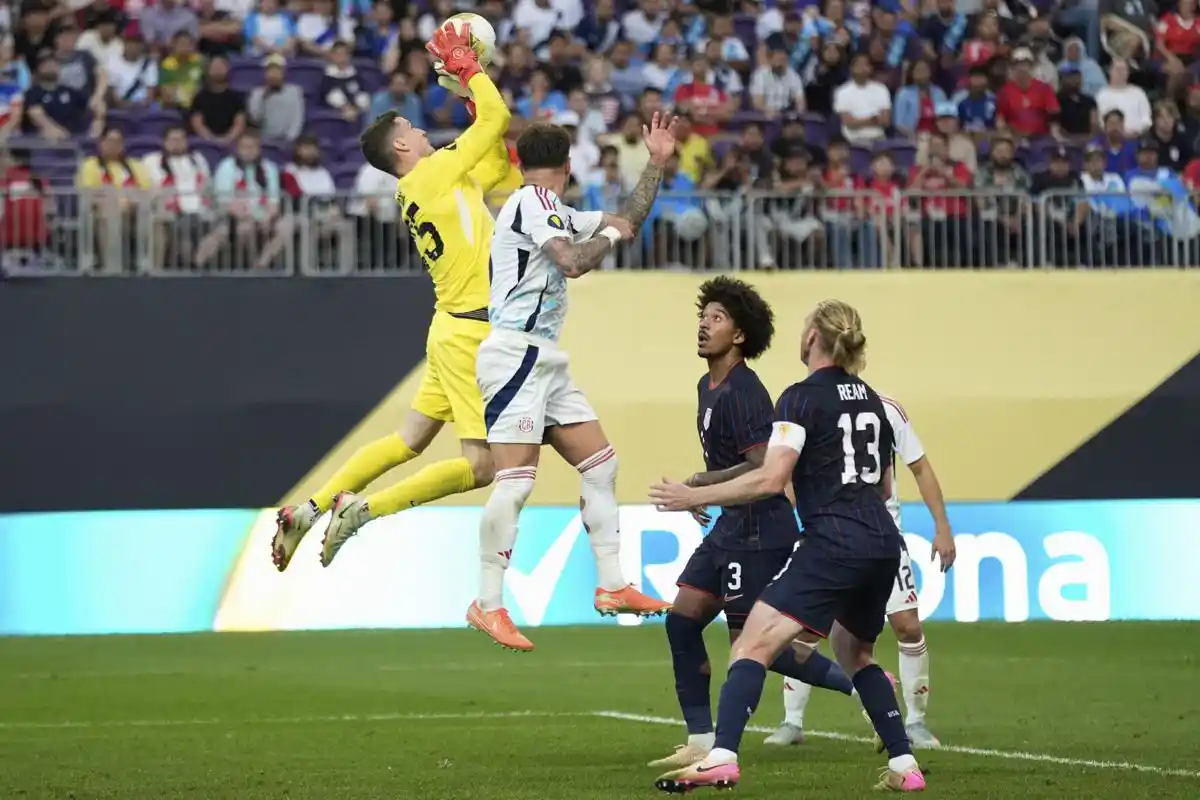 USA goalkeeper Matthew Freese catches a high ball in his penalty box