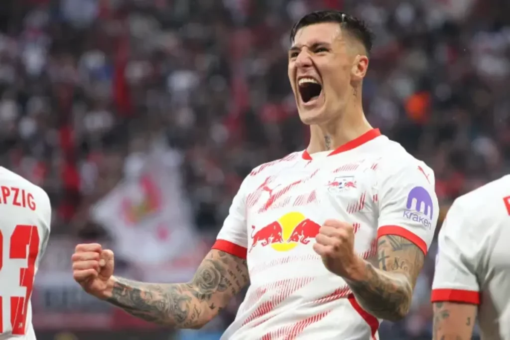 Benjamin Sesko celebrates after scoring for EB Leipzig