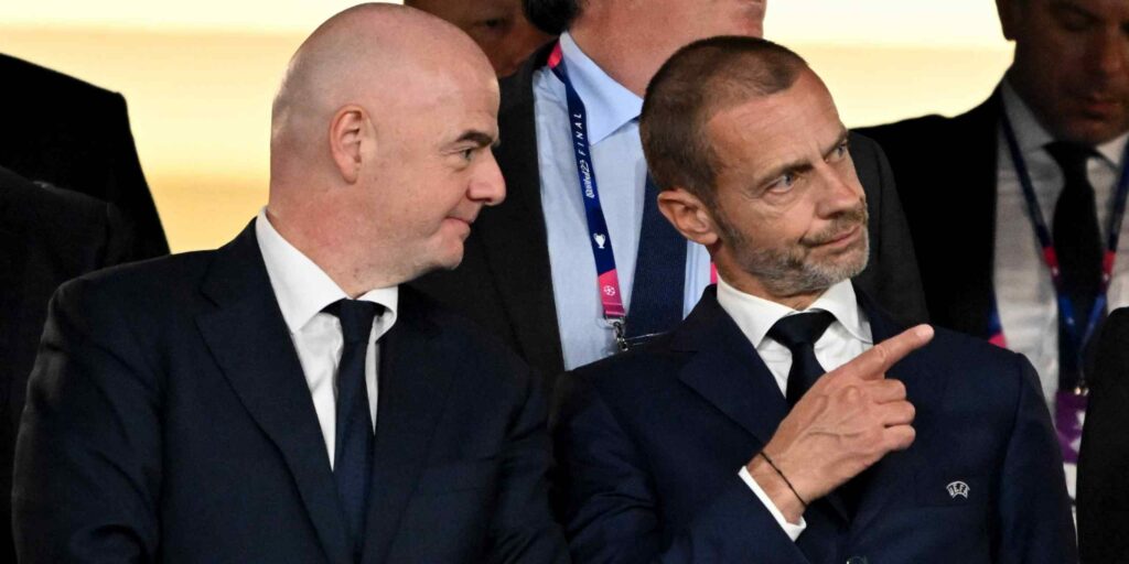 Presidents of FIFA (Gianni Infantino) on the left, and UEFA (Aleksander Ceferin) on the right