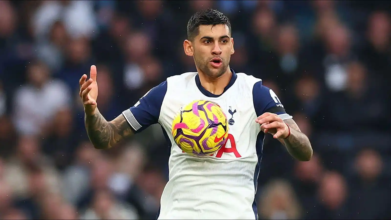 Tottenham defender Cristian Romero controlling the ball