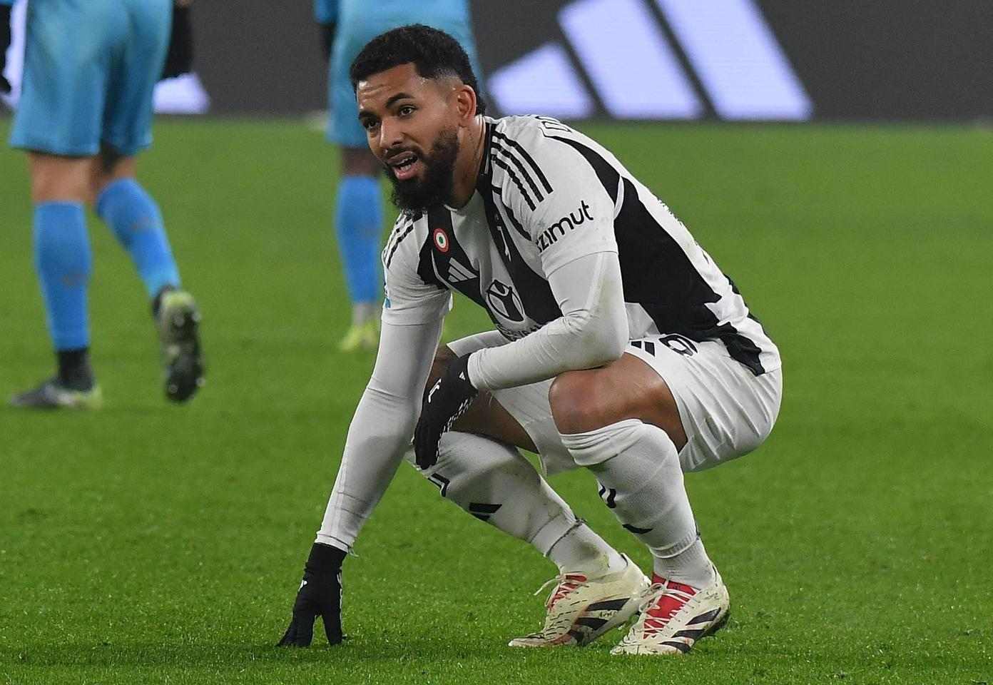 Juventus midfielder Douglas Luiz taking a breath