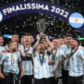 Leo Messi and Argentina lifting the Finalissima trophy in 2022
