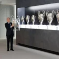 Real Madrid president Florentino Perez holding the Champions League trophy
